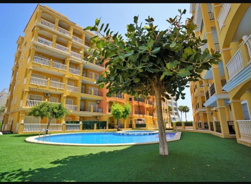 Sunny ground floor apartment with a large terrace and direct access to the pool — photo 1
