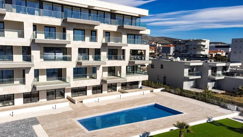 Seaside apartments with a swimming pool Seget Donji — photo 1