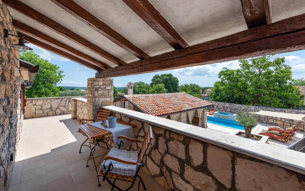 Rustic stone holiday house with pool photo 2