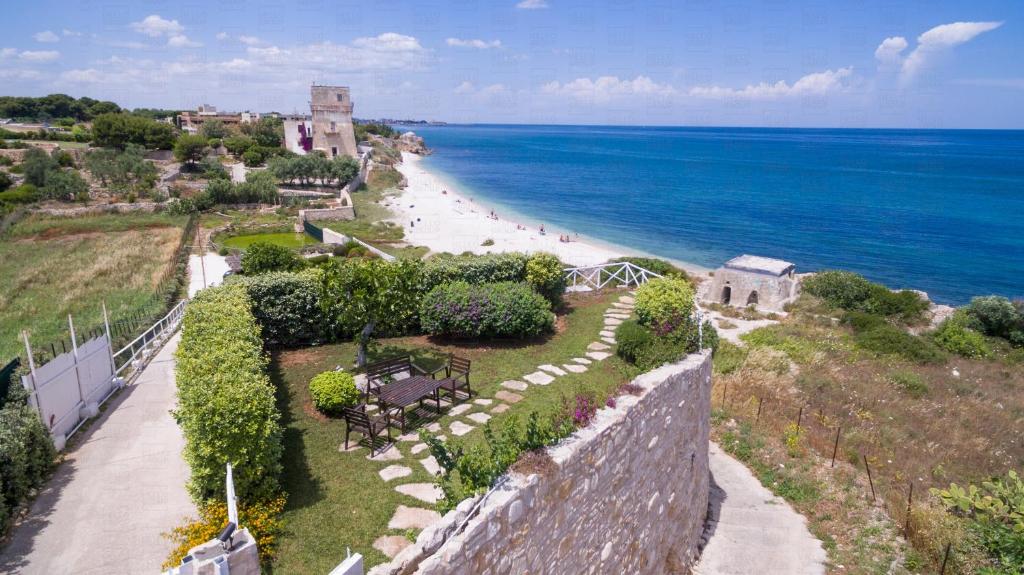 HelloAPULIA - Sweet Trullo on the Beach - Unique Seafront house with Direct Beach "Ponte Lama" Access and Private Patio — photo 1