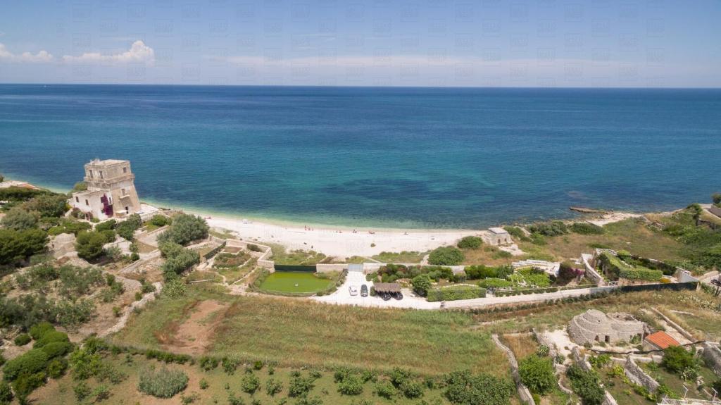 HelloAPULIA - Sweet Trullo on the Beach - Unique Seafront house with Direct Beach "Ponte Lama" Access and Private Patio photo 2