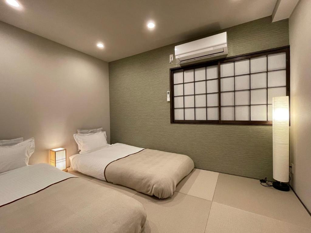 天下茶屋车站2分钟 独栋四卧室两厅 可住8人 高速Wi-Fi photo 2