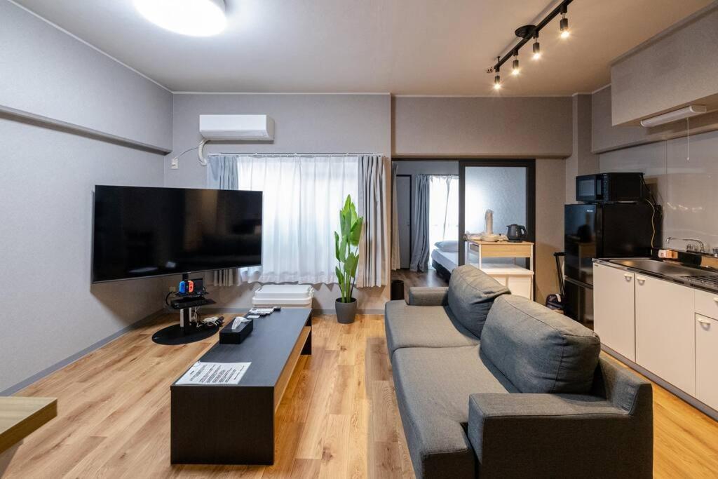 TasoneUrbanStayOsaka なんば日本橋南不夜城703 — photo 1