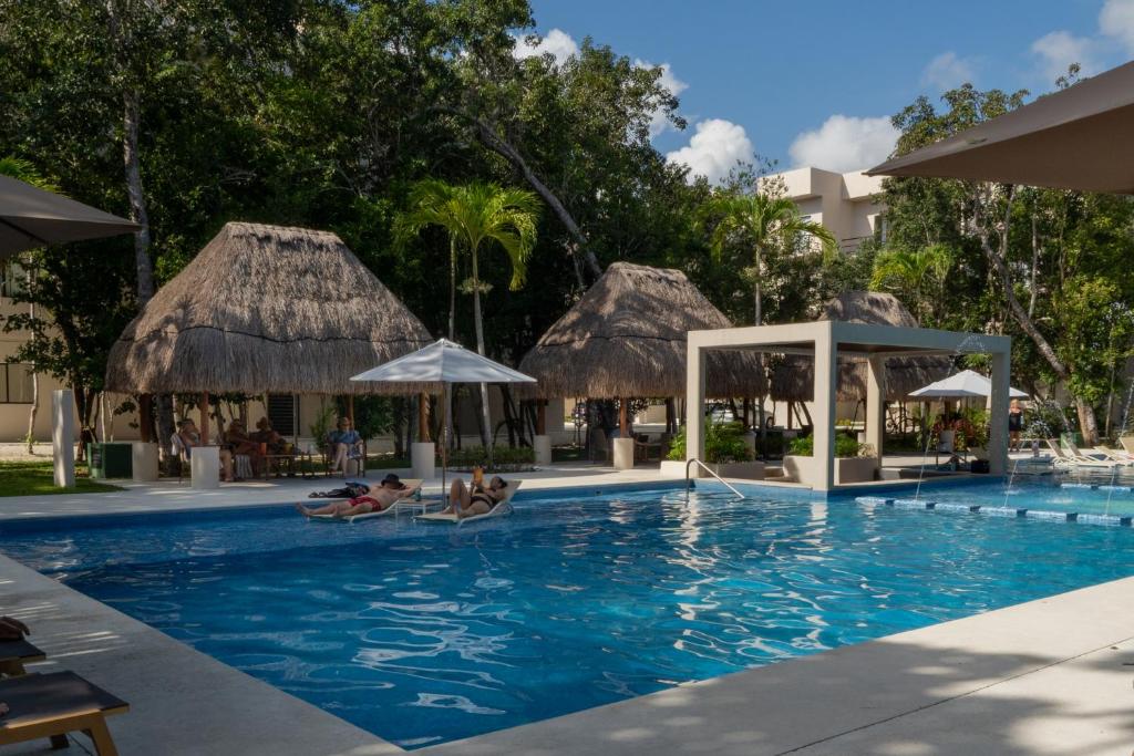 Custom decor-sleeps 6 with 2 pools- Condo near beach-Puerto Morelos Mexico photo 2