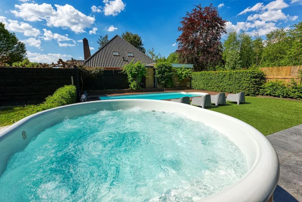 Yellow Tiny House with shared pool photo 3