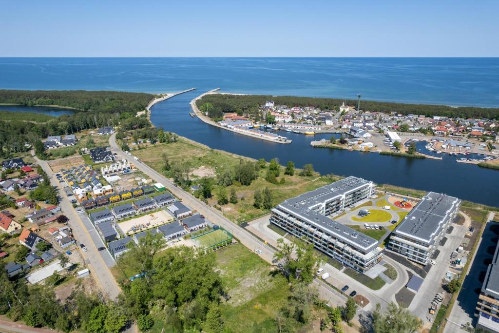 Wellness & SPA Resort Dziwnów Riverfront Apartments with Parking by Noclegi Renters — photo 1