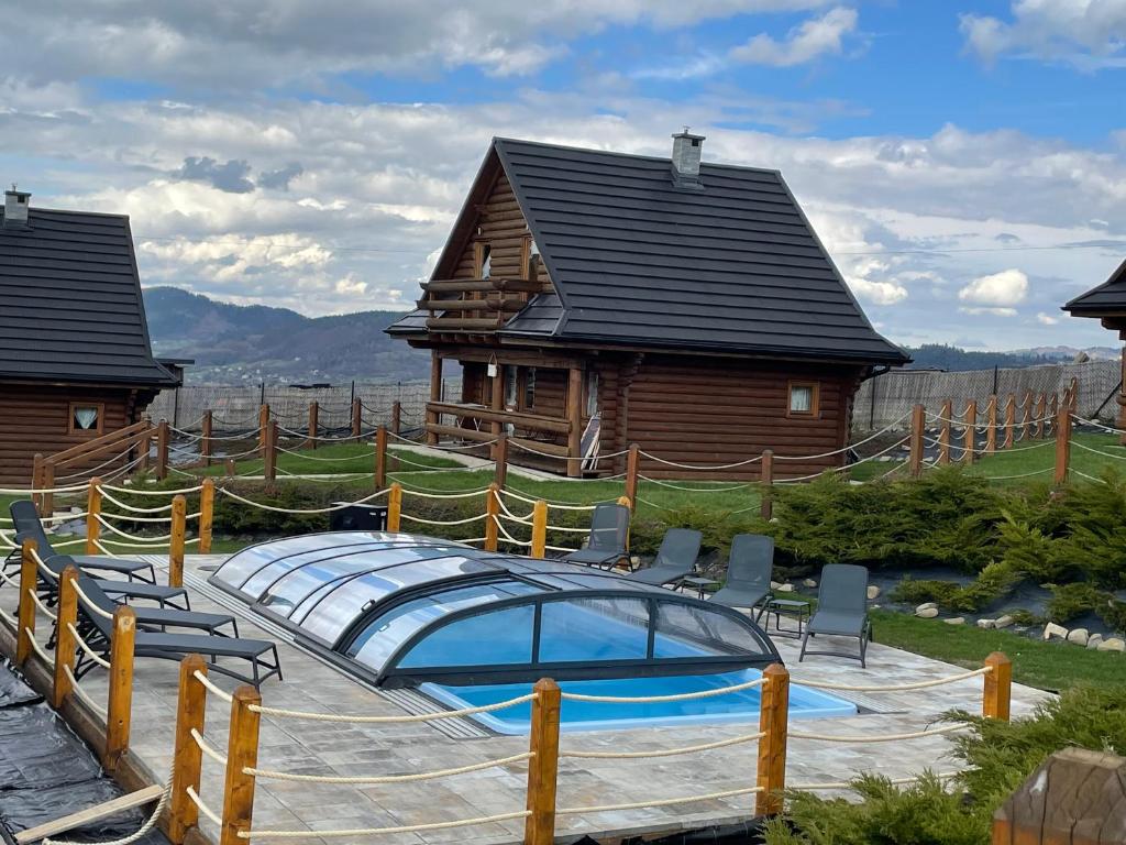 Domki Zagroda Domek z bala z basenem & sauna & balia z hydromasażem — photo 1